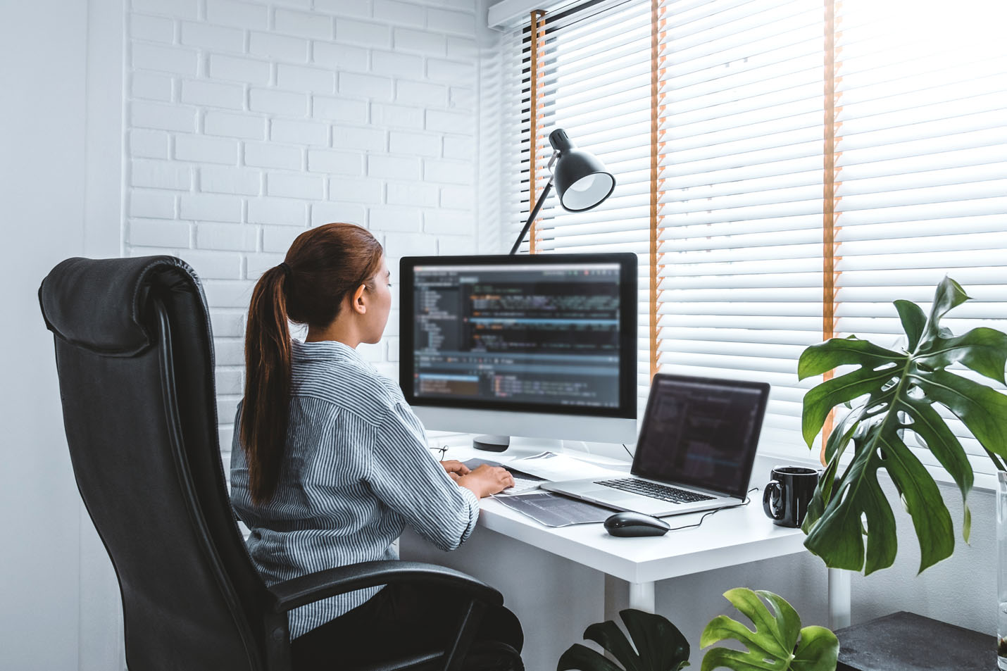 A woman enjoying working at home
